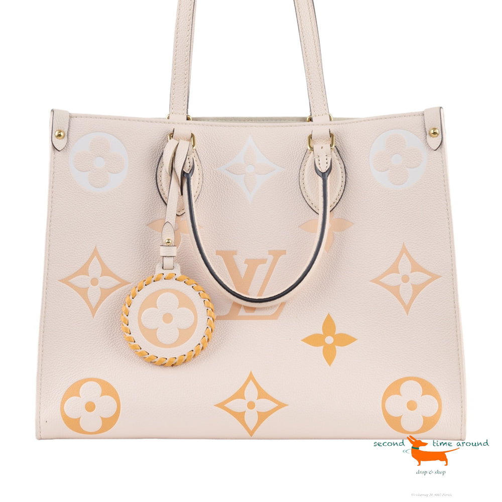 Louis Vuitton Onthego MM limited edition in beige imprint leather Bag