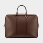 Secondtimearound brown leather briefcase with top handles and silver hardware. Classic design for business travel.