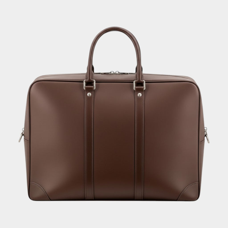Secondtimearound brown leather briefcase with top handles and silver hardware. Classic design for business travel.