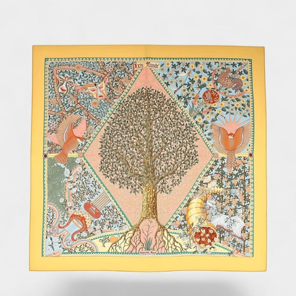 Secondtimearound Hermes Axis Mundi silk scarf by Christine Henry, featuring a central tree of life motif with birds, a cornucopia, and intricate floral patterns on a yellow background.