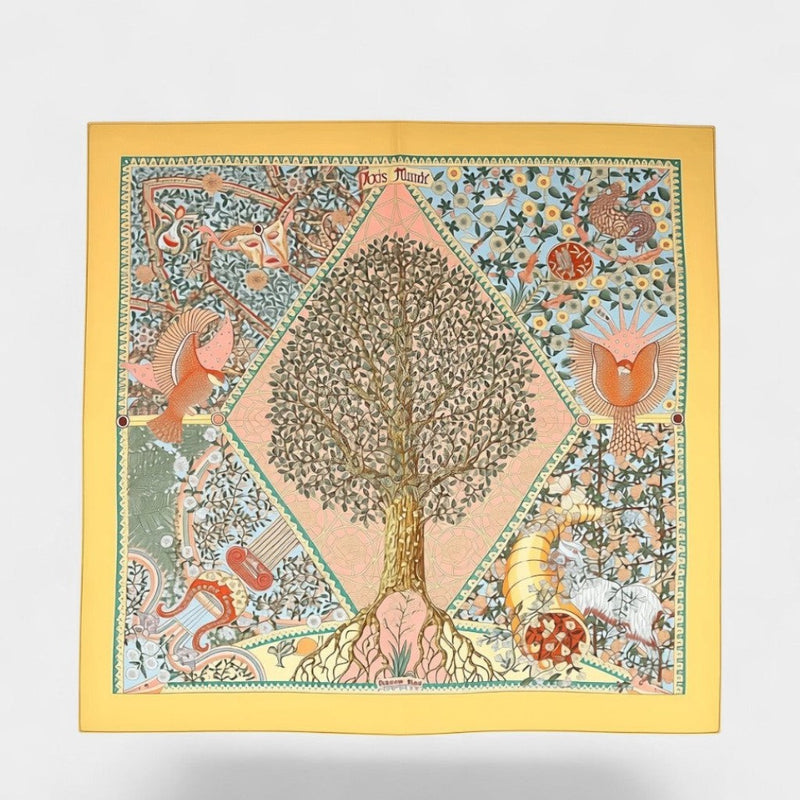 Secondtimearound Hermes Axis Mundi silk scarf by Christine Henry, featuring a central tree of life motif with birds, a cornucopia, and intricate floral patterns on a yellow background.