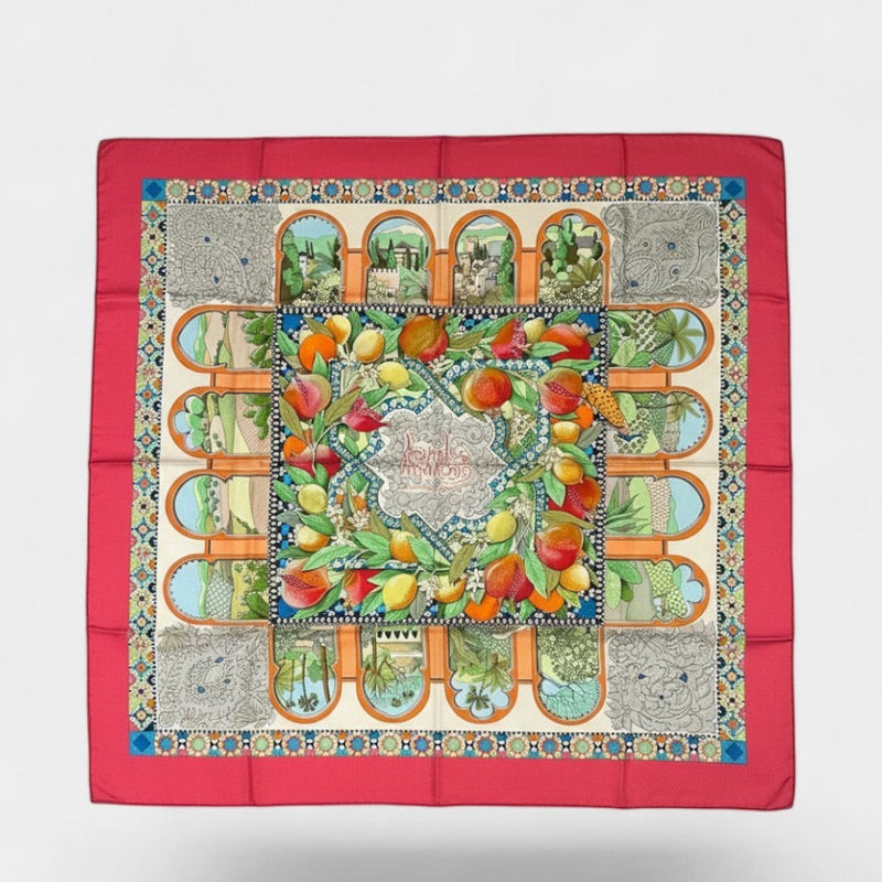Secondtimearound Hermes Les Jardins d'Andalousie silk scarf by Aline Honoré, featuring a vibrant fruit motif and architectural details.