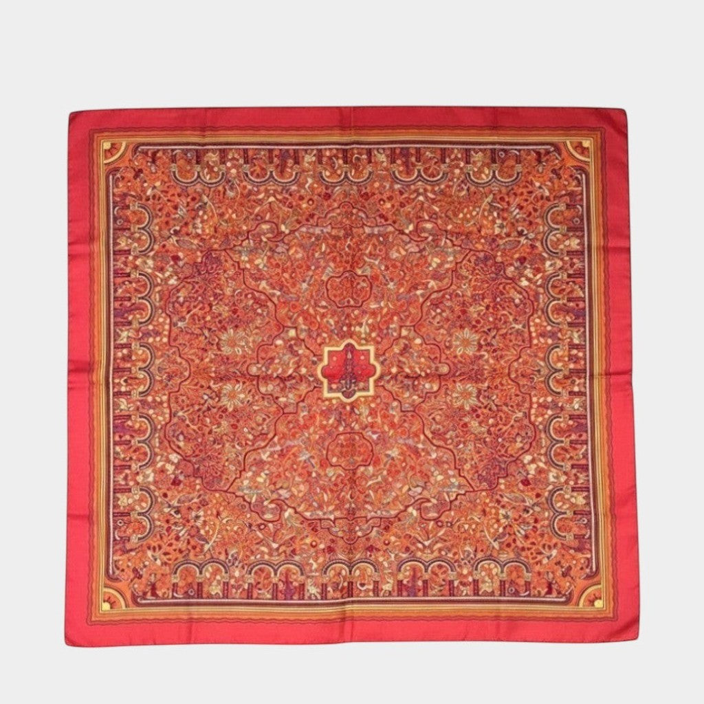 Secondtimearound Hermes Les Jardins d'Arménie silk scarf by Karen Petrossian, red with intricate floral and architectural patterns.