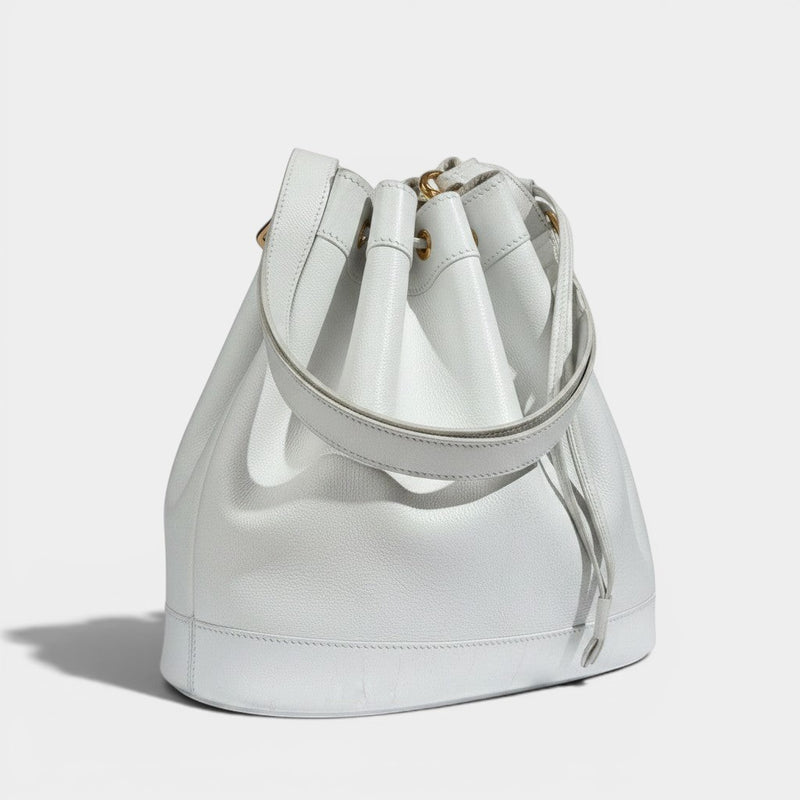 Secondtimearound Hermes Market Bag, white pebbled leather drawstring bucket bag with gold hardware.