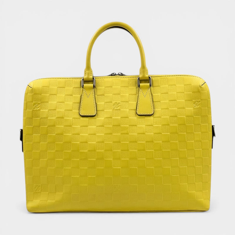 Secondtimearound Louis Vuitton Damier Infini Porte-Documents Jules yellow leather briefcase with embossed checkerboard pattern.