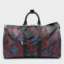 Secondtimearound Louis Vuitton Keepall Bandouliere 45 bag in Damier Cobalt Camouflage print with black leather trim and strap.
