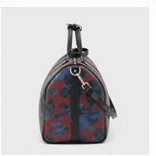 Secondtimearound Louis Vuitton Keepall Bandouliere 45 bag in Damier Cobalt Camouflage print with black leather trim and silver hardware.