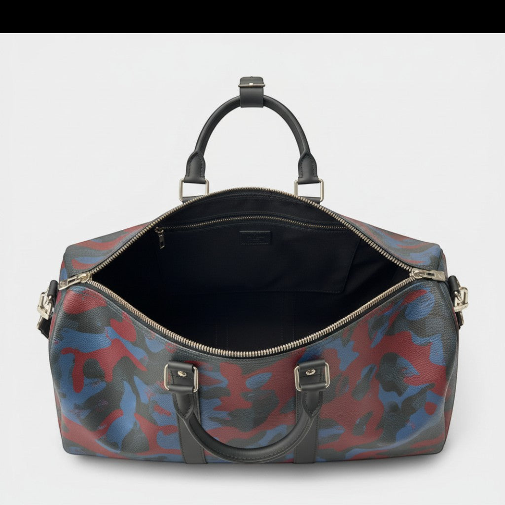 Secondtimearound Louis Vuitton Keepall Bandouliere 45 bag in Damier Cobalt Camouflage print with leather trim and silver hardware.