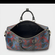 Secondtimearound Louis Vuitton Keepall Bandouliere 45 bag in Damier Cobalt Camouflage print with leather trim and silver hardware.