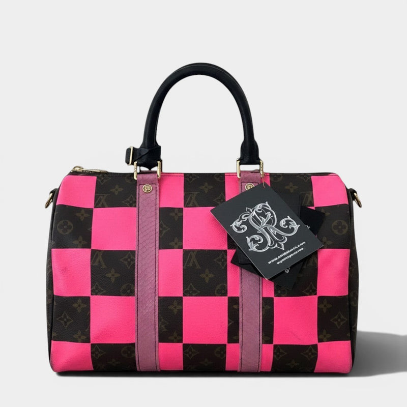 Secondtimearound Louis Vuitton Speedy 35 bag with brown monogram canvas and pink checkerboard overlay, black handles, and pink snakeskin trim.