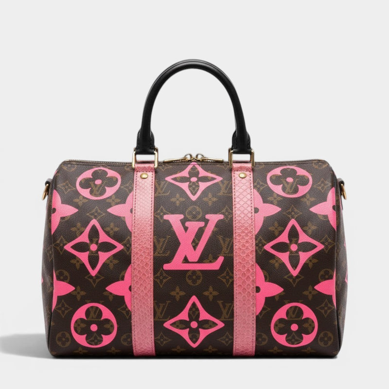 Secondtimearound Louis Vuitton Speedy 35 bag in brown monogram canvas with pink LV logo and flower print, black leather handles, and pink trim.